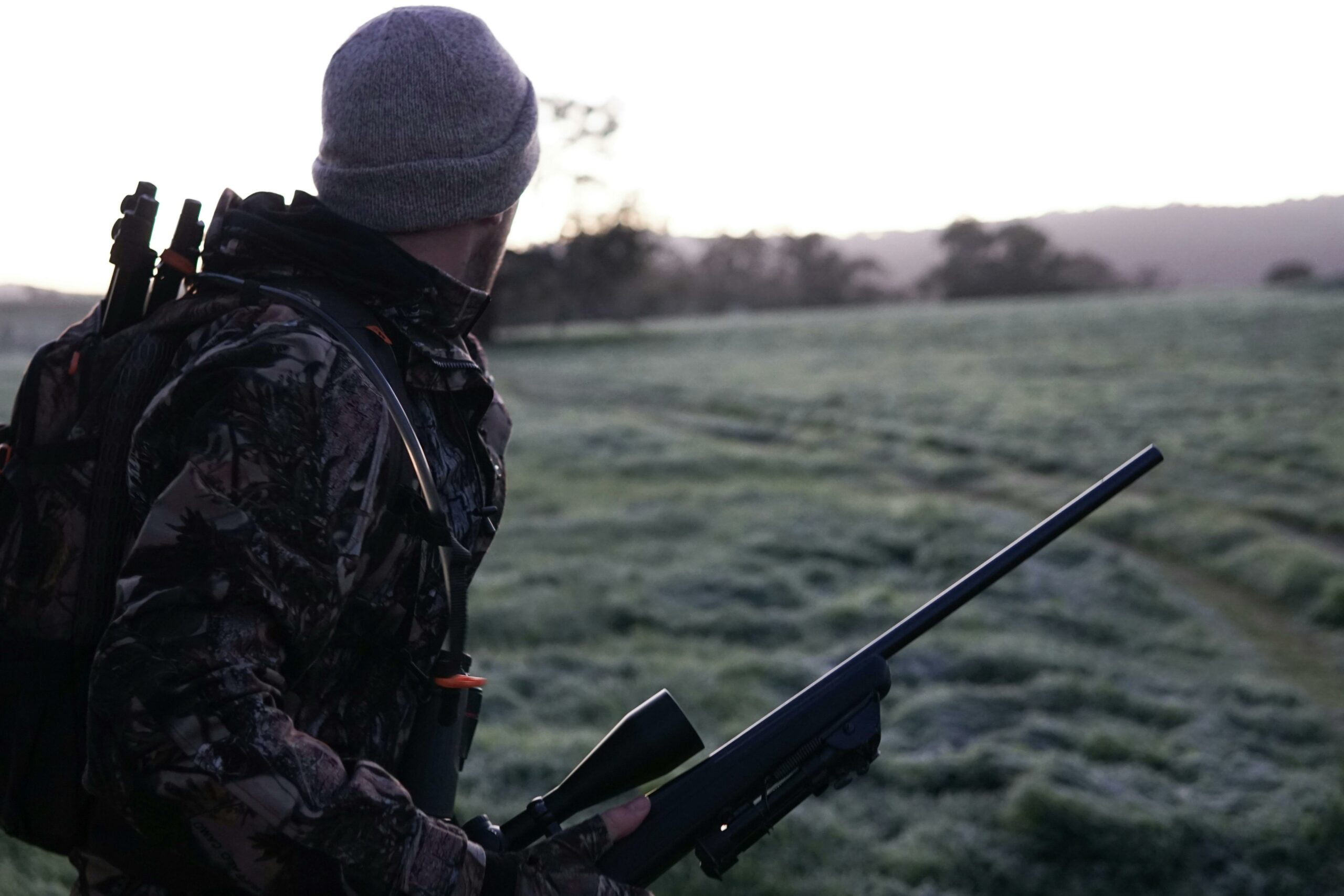 hunter with hunting rifle using complexus tracker